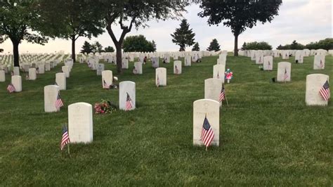 Volunteers honor fallen veterans by placing nearly 200,000 flags at Fort Snelling National ...