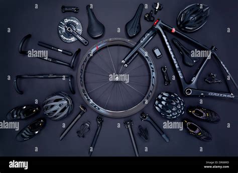 Road bike parts and accessories on a black background Stock Photo - Alamy