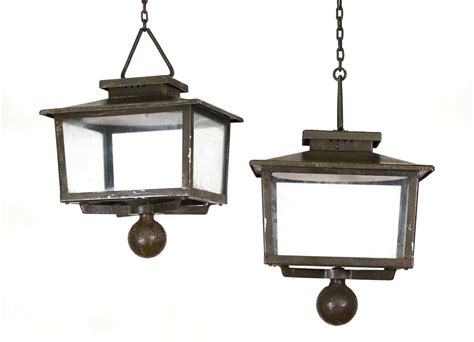 Lot 210 - A pair of iron exterior lanterns,