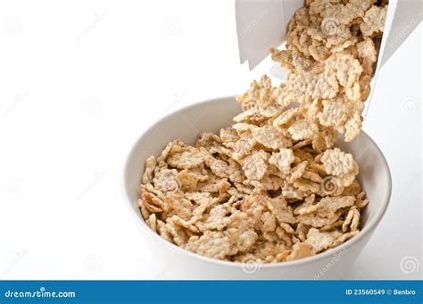 Cereal pouring into a bowl stock image. Image of muesli - 23560549