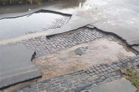 St Neots flooding sees road surface damaged revealing Victorian cobbles ...