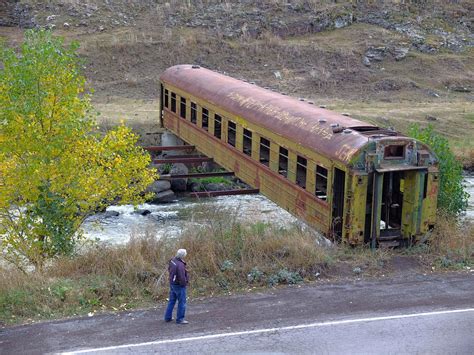 Bridge made from an old rail car over a river in the South Georgian ...