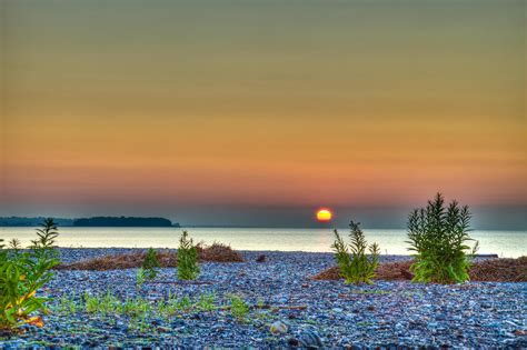 Beach Sunrise A Ground Level View I Photograph by John Supan - Pixels