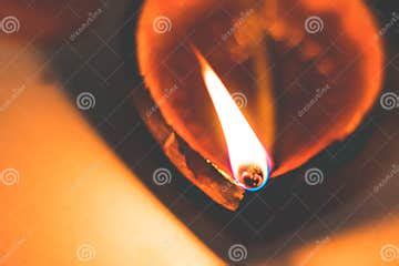 Diwali Oil Clay Lamp Also Called Aladdin Lamp on a Dark Orange Black ...