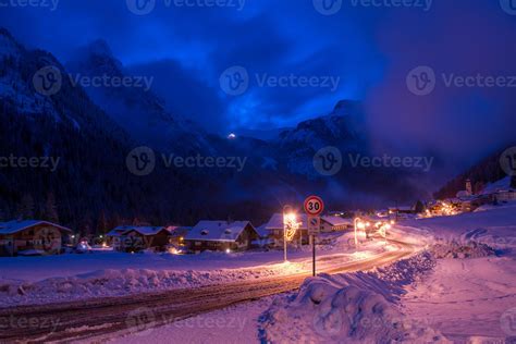 mountain village in alps at night 10681926 Stock Photo at Vecteezy