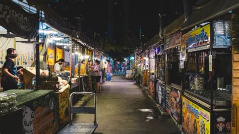 Night Street Food Market in Bangkok, Thailand Bustling with Shoppers ...