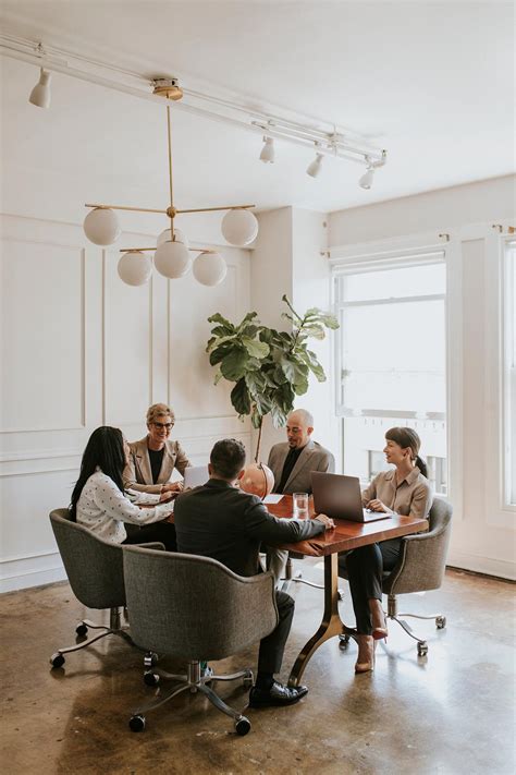 Happy business people in a meeting | Premium Photo - rawpixel