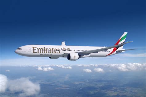 cb9bf-emirates-boeing-777-300er-flight-clouds-jet - Steele Luxury Travel