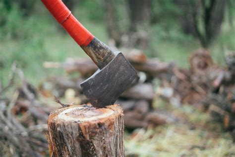 Photo Of Axe On Wooden Log · Free Stock Photo