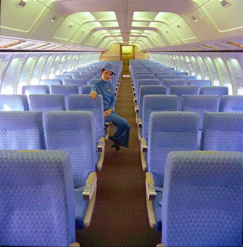 The Sumptuous Arrowhead Blue Coach Class Boeing 727 Interior with Hostess Modeling 1974 Emilio ...
