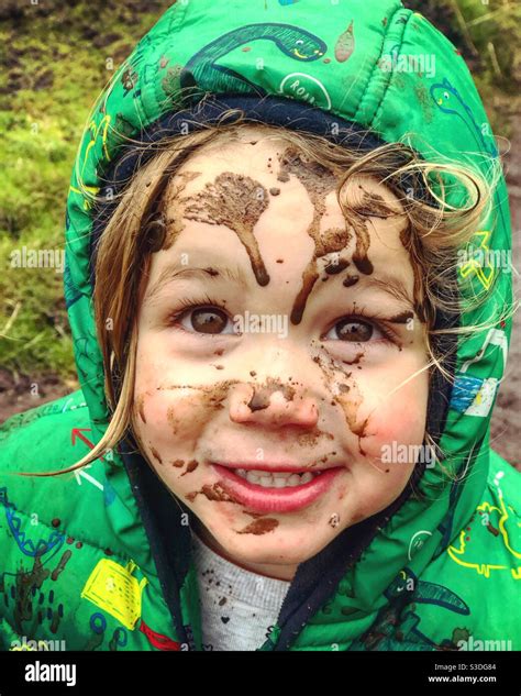 Toddler with muddy face Stock Photo - Alamy