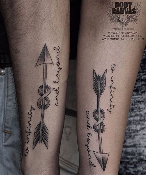 two people with tattoos on their legs and one has an arrow, the other is a cadus