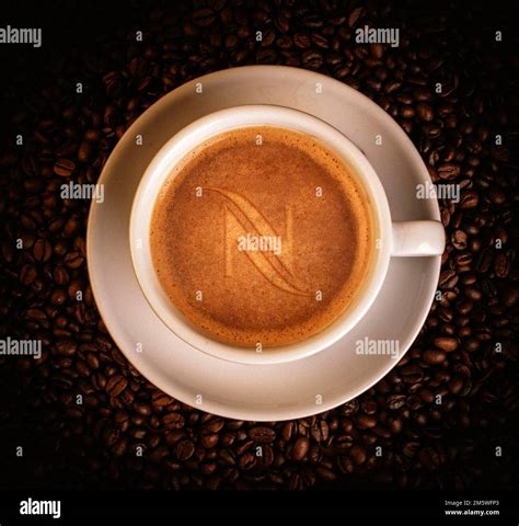 Food photography, coffee cup with coffee and Nespresso logo Stock Photo - Alamy