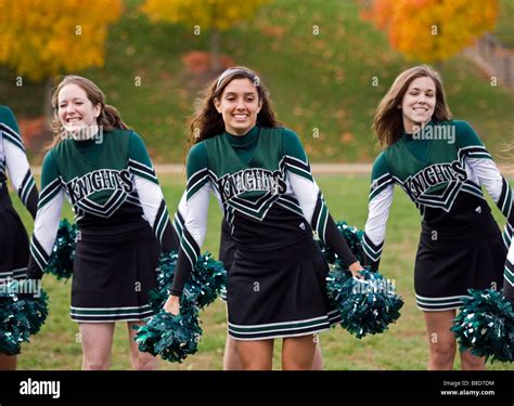 High school cheerleaders in uniform practice at their private school Stock Photo - Alamy