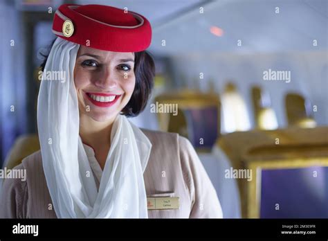 DUBAI - FEB 13: Emirates crew member in Boeing 777-300ER aircraft on February 13, 2013 in Dubai ...
