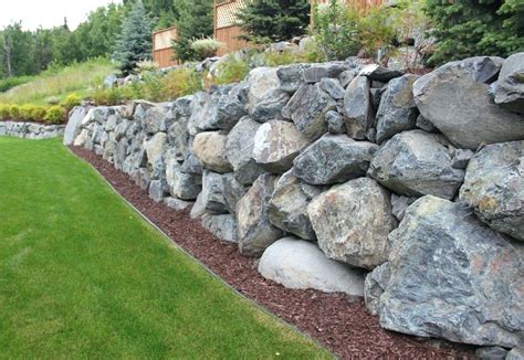 dry stacked rip rap retaining wall - Google Search | Rock wall landscape, Landscaping retaining ...