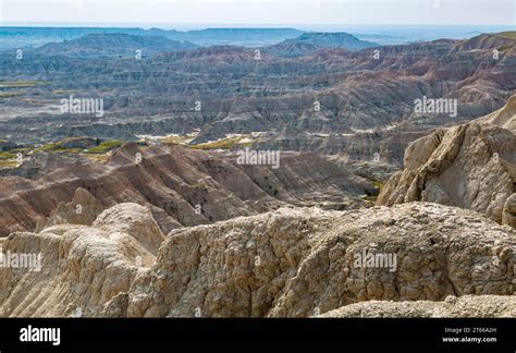 Erosion exposes colorful layers of sedimentary rock in the Badlands National Park in South ...