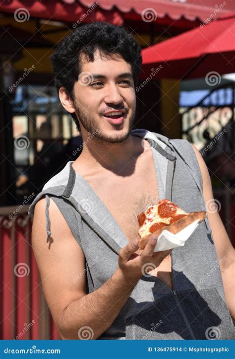 Happy Young Man Eating Pizza Outdoors Stock Photo - Image of cafe, summer: 136475914