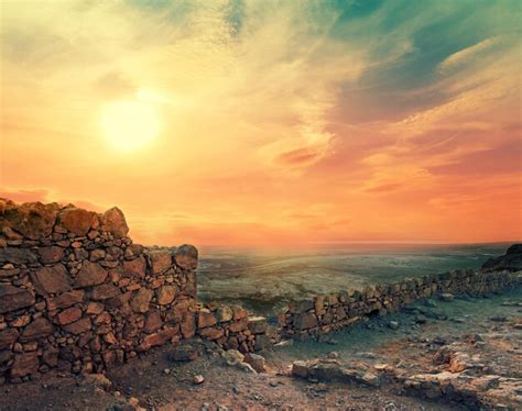 Premium Photo | Beautiful purple sunrise over masada fortress ruins of ...