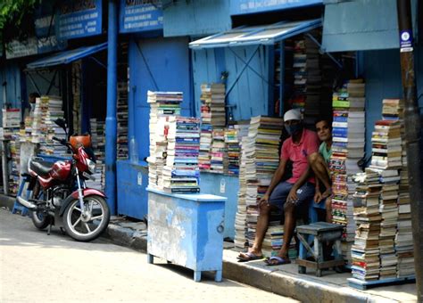 Customers purchase books from book stalls at College street Book market ...