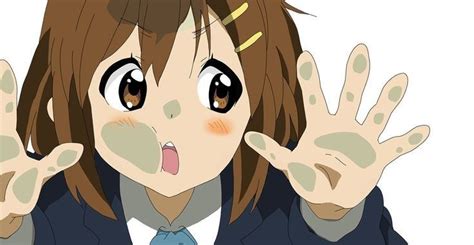 an anime girl with her hands in front of her face, making the vulcan sign