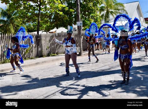 Female Belizean dancers, in blue and white costumes, dancing in the San ...