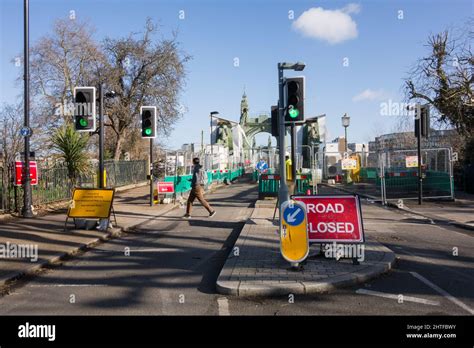 A still closed Hammersmith Bridge and road closure signage in southwest London, England, UK ...