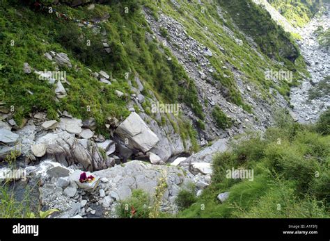 Tibetan buddhist monk meditating in remote mountain gorge Stock Photo - Alamy