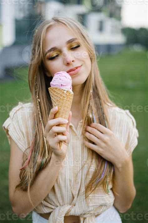 Happy young girl holding ice cream and enjoying a summer day 12621474 ...