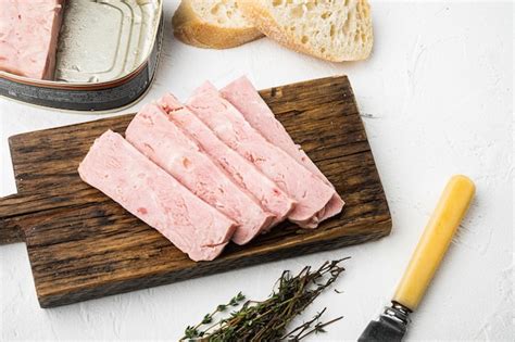 Premium Photo | Canned ham slices sandwich on white stone table background