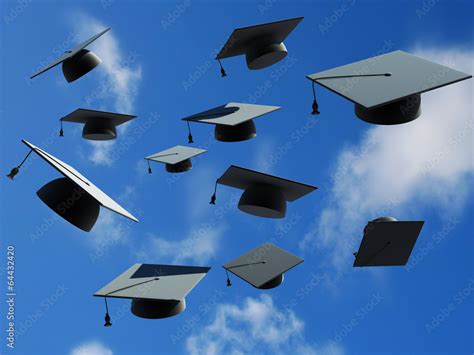 graduation caps thrown in the air Stock Photo | Adobe Stock