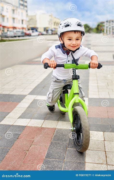 Boy in a Helmet Riding Bike Stock Image - Image of child, outdoor: 95819271