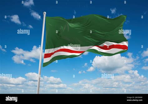 flag of Chechen Republic of Ichkeria, Europe at cloudy sky background. flag representing extinct ...