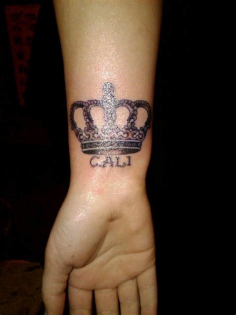 Cool crown and inscription tattoo - Tattooimages.biz