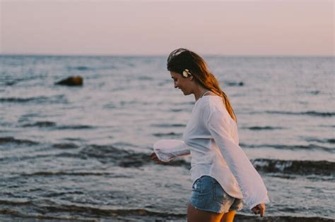 Premium Photo | Carefree woman on the beach