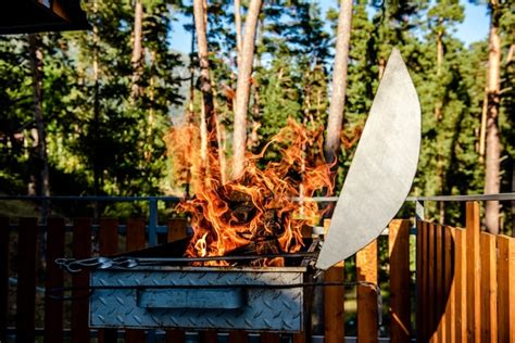 Premium Photo | Fire burning in a brazier in nature in summer