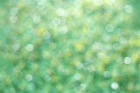 Nature green light circle bokeh abstract background with space for ...