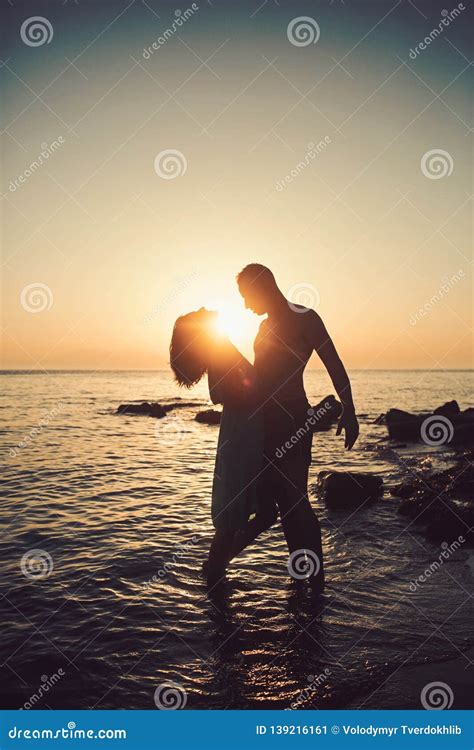 Romantic Young Couple on the Beach, Silhouette. Stock Image - Image of ...