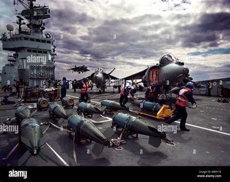 Harrier jump jet landing on the Royal Navy aircraft carrier HMS ...