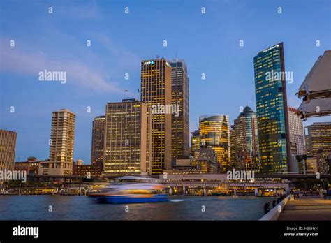 View on Sydney downtown at Circular quay with ferry terminal at night ...