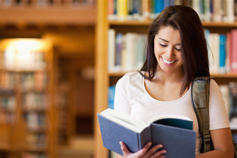 Cute student reading a book - Wayland Free Public Library