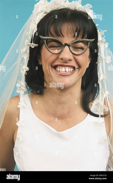 Portrait of bride wearing funny glasses Stock Photo - Alamy