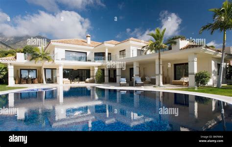 Swimming pool in front of large modern white Spanish villa Stock Photo, Royalty Free Image ...