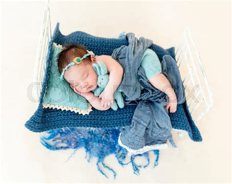 Newborn Baby Girl Sleeping In A Little Bed Stock Image Colourbox | ubicaciondepersonas.cdmx.gob.mx