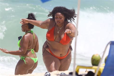 Lizzo rocks tiny red bikini beachside during Brazilian vacation