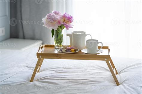 Tray with breakfast on bed. 16070885 Stock Photo at Vecteezy