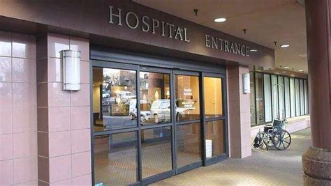 Hospital entrance doors, exterior with no people. - Stock Video Footage - Dissolve