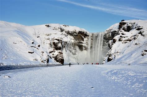 Skógafoss Waterfalls below the Eyjafjöll mountains and west of Mýrdalsjökull Glacier