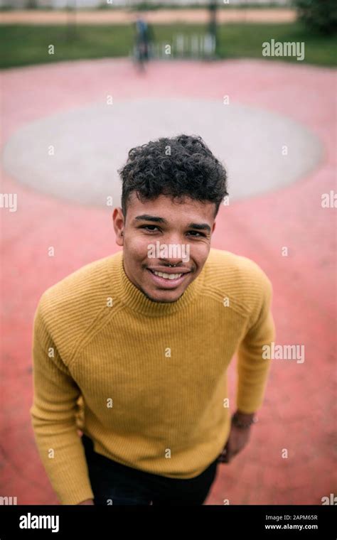 Portrait of smiling young man outdoors Stock Photo - Alamy