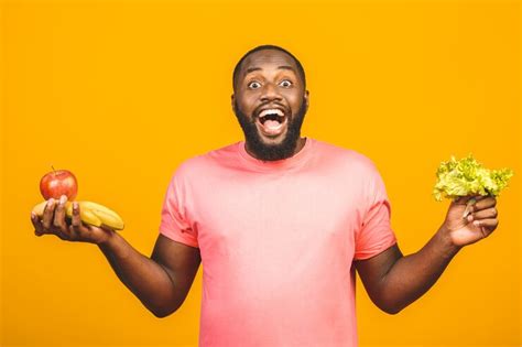 Premium Photo | Diet concept. healthy african american black man holding fruits.